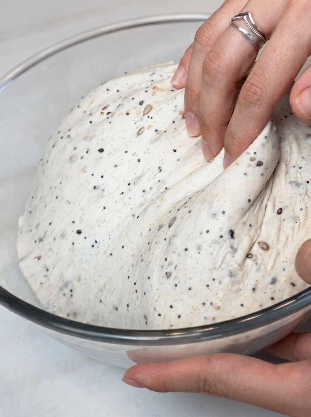 Sourdough dough pulling cleanly away from the side of a bowl during bulk fermentation